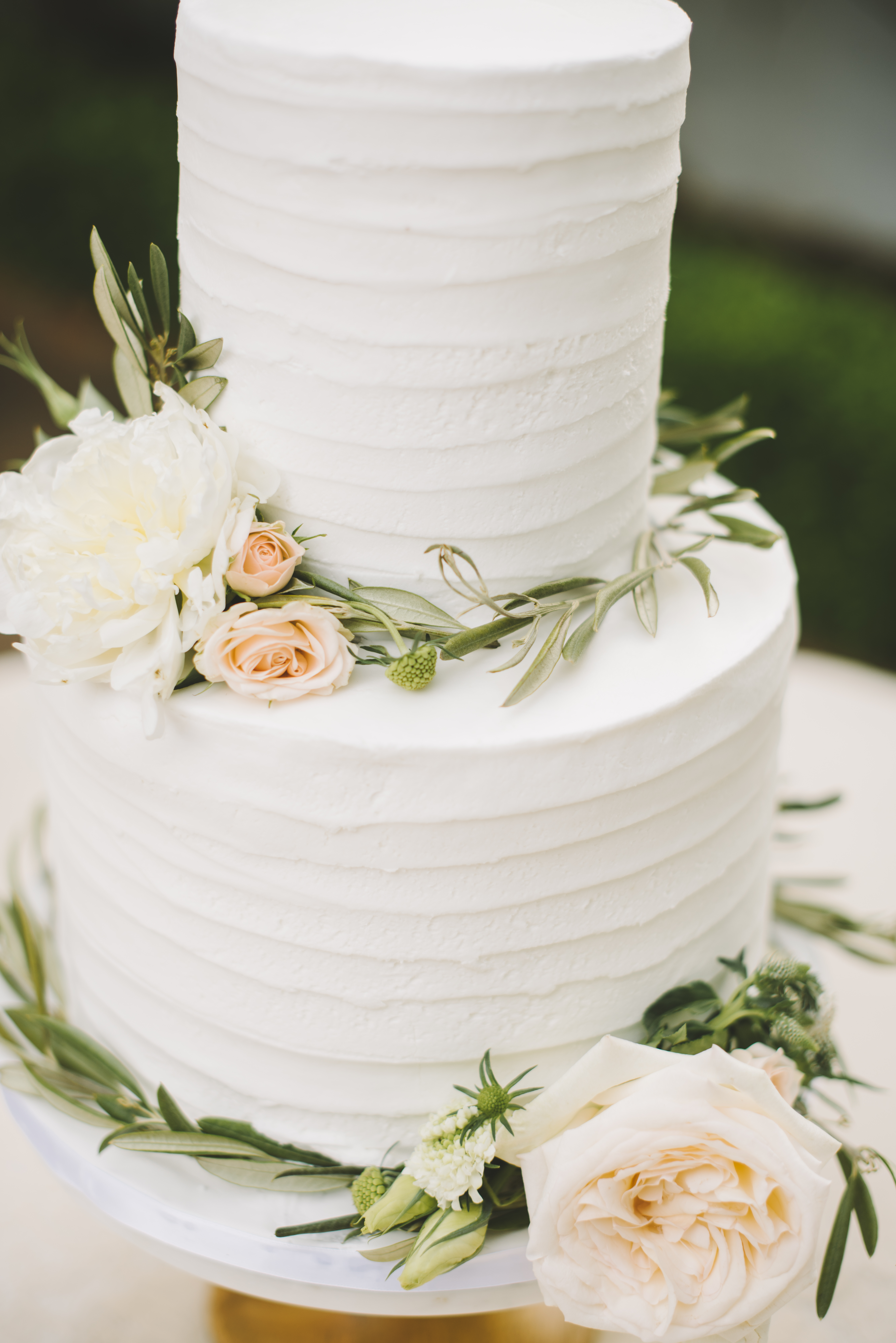 Wedding Cake with flowers ang olive leaves